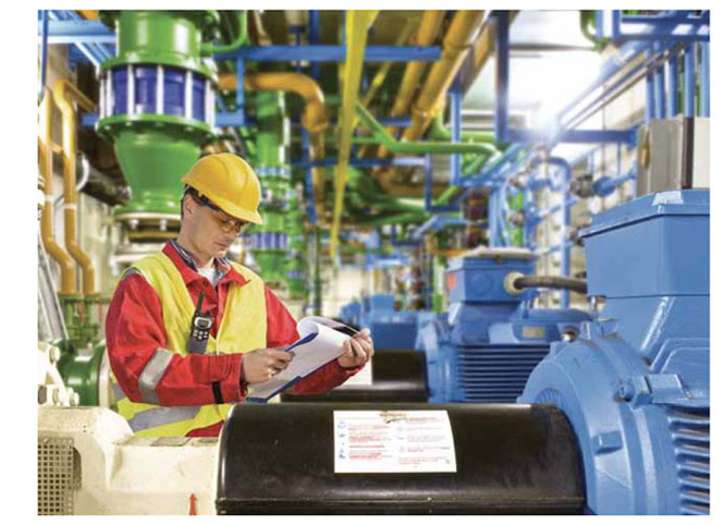 Image of worker performing safety check on equipment